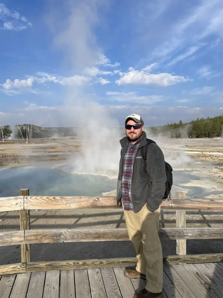 Man in front of hot springs