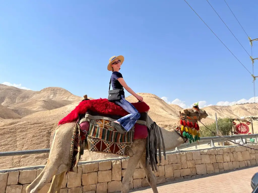 Girl riding a camel in Israel