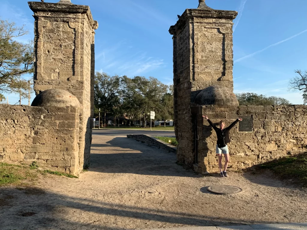 Taking a photo in front of the Old City Gate in St. Augustine