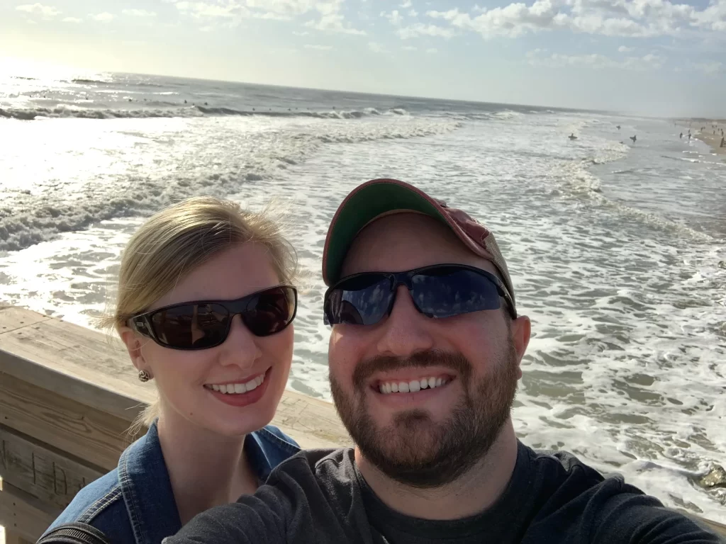 husband and wife taking a selfie on the st. augustine pier