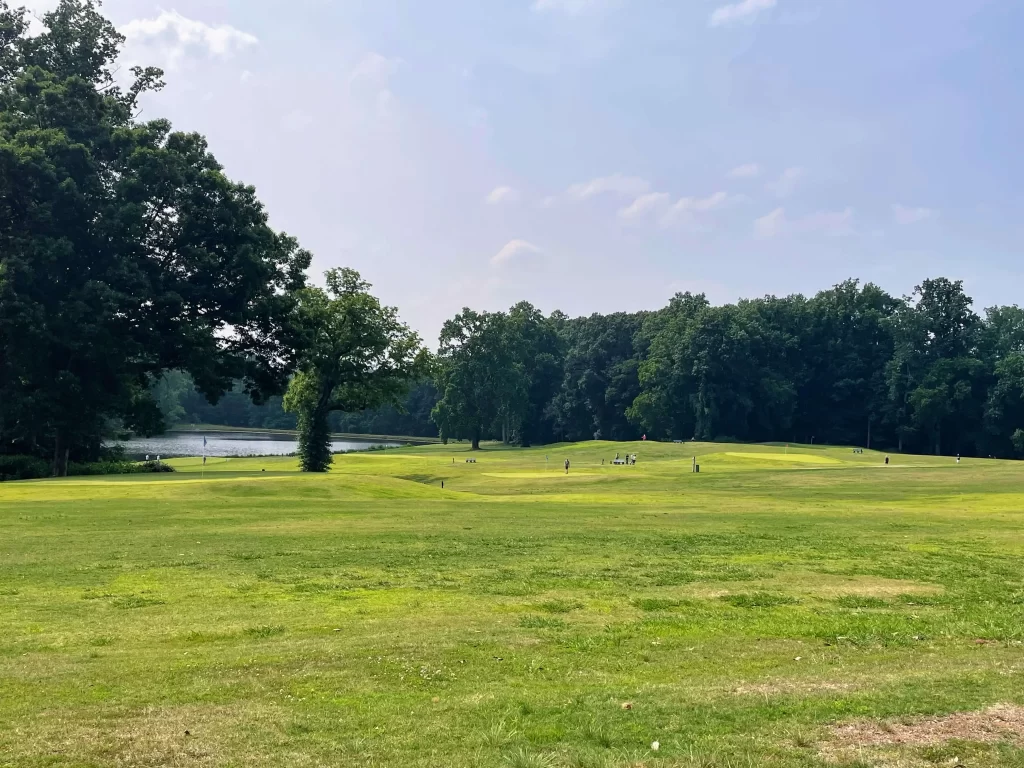 One of the golf courses with the pond in the background at Tanglewood Park 