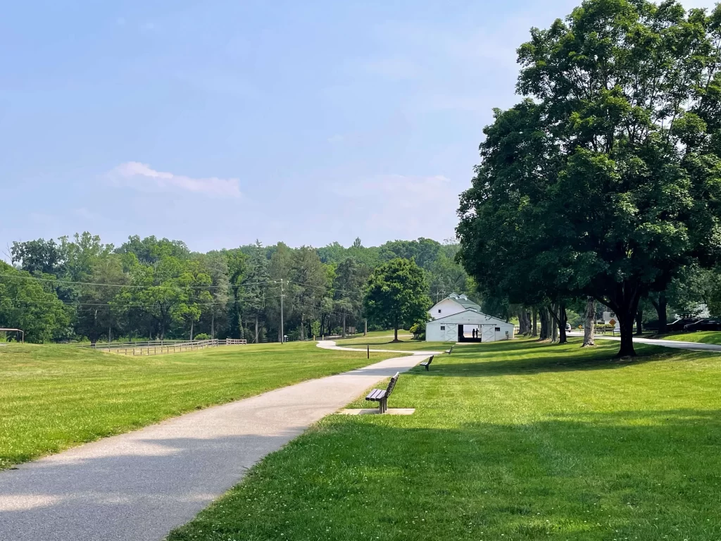 View of a paved walking trail at tanglewood park clemmons north carolina